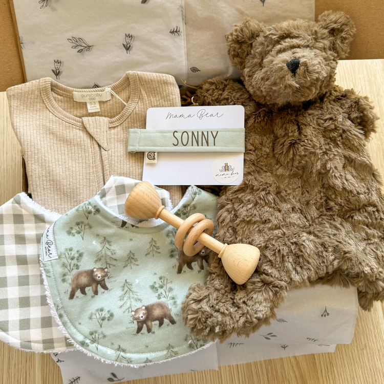 Premium baby boy gift box featuring personalised dummy chain, soft bear toy, sage check and bear print bibs, wooden baby rattle and biscuit bodysuit. Ideal newborn gift or baby shower hamper in Australia.