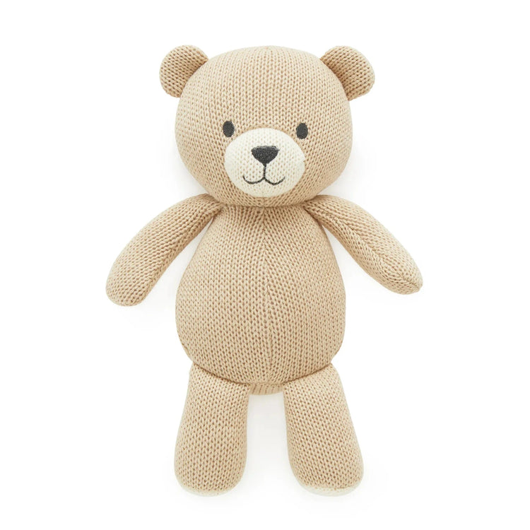 Knitted teddy bear on a white background