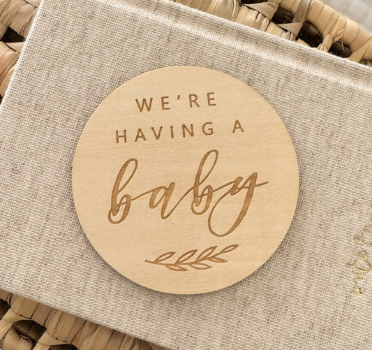 Wooden disc 'We're having a baby'