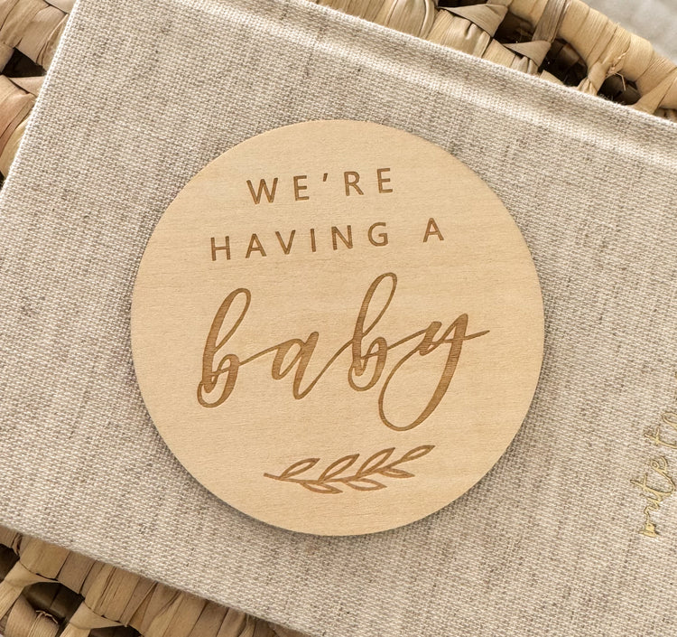 Wooden disc 'We're having a baby'