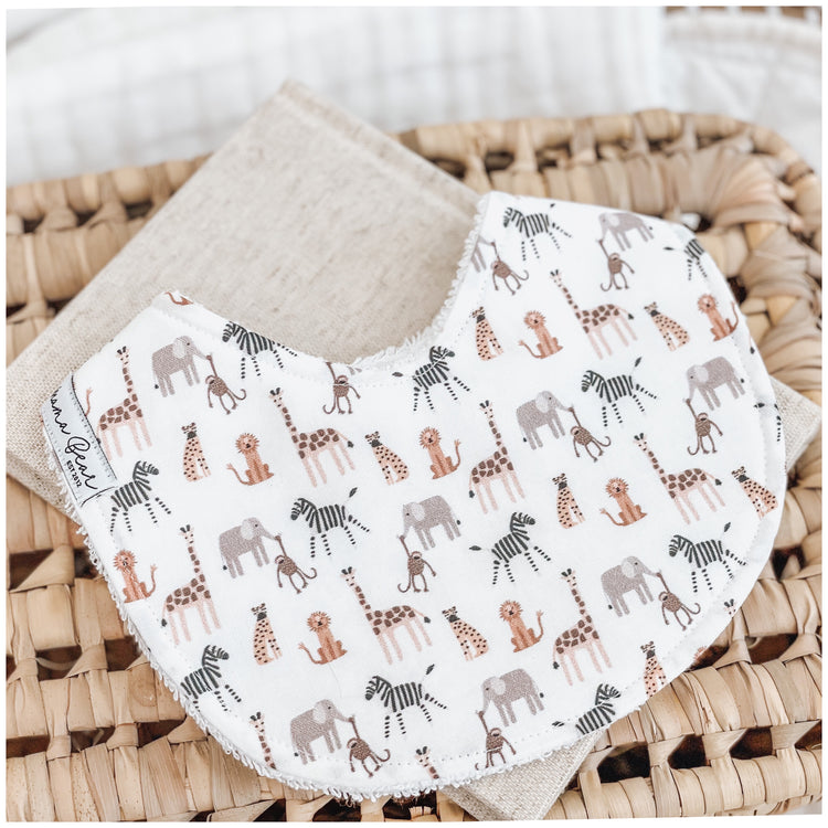 Animal baby bib, gender neutral / unisex. Features mini safari animals, lions, cheetah, elephant, zebra, monkey, giraffe on it.