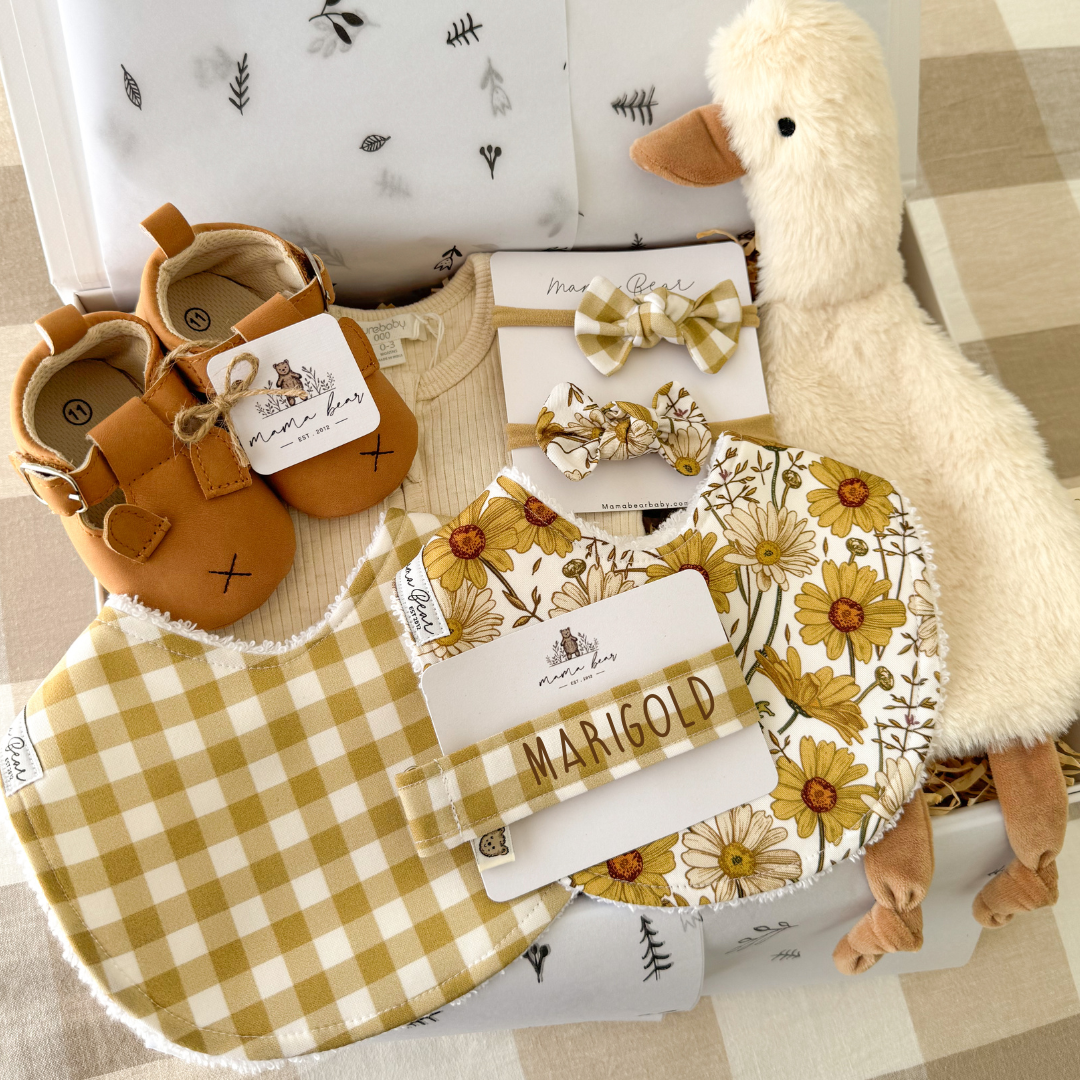 Personalised baby girl gift box in mustard tones with floral bibs and bow headbands
Mustard baby girl gift set with handmade bibs, bows and soft plush duck
Personalised newborn gift box for baby girl in mustard and earthy floral colours
Mustard floral baby girl gift box with handmade bibs and bow headbands
Earthy mustard baby girl gift set with personalised baby accessories