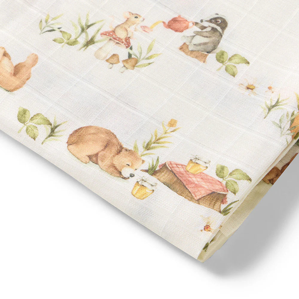 baby swaddle with animal and nature-themed embroidery on a white background