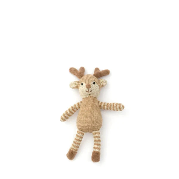 Knitted reindeer toy on a white background