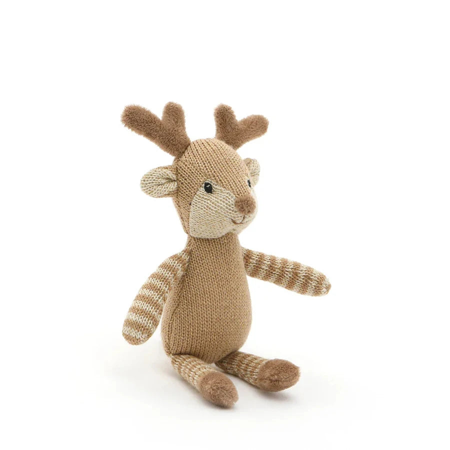 Knitted toy reindeer on a white background