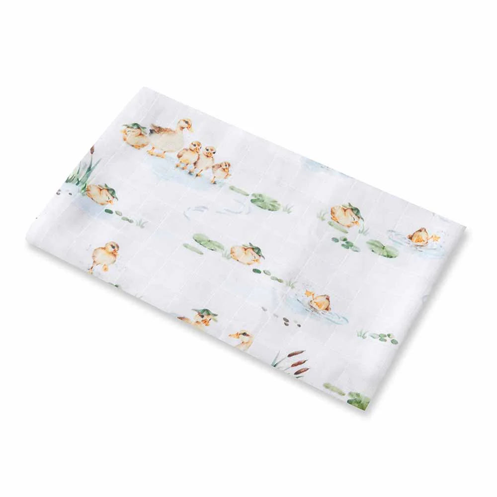 White baby swaddle blanket with baby ducklings