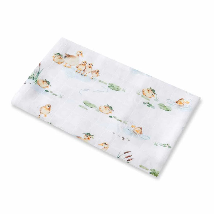 White baby swaddle blanket with baby ducklings
