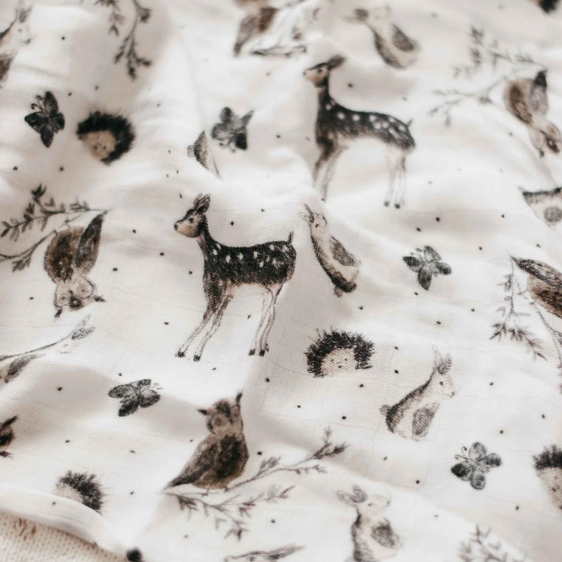 Fabric with black animal prints on a white background